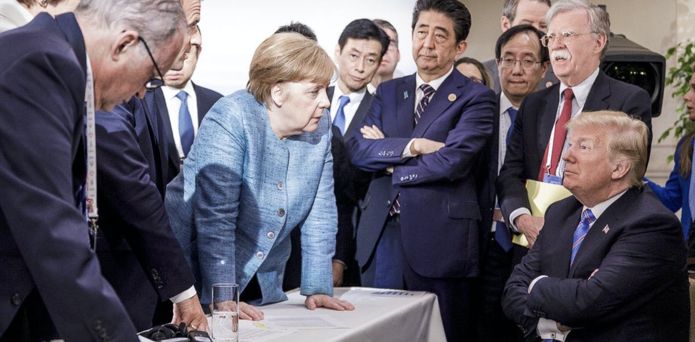 German Chancellor Angela Merkel, center, speaks with U.S. President Donald Trump, at the contentious G7 Leaders Summit in Canada in June. AP/Jesco Denzel/German Federal Government